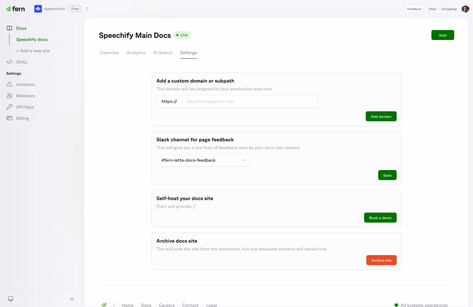 The docs site settings screen in the Fern dashboard: add a custom domain or subpath, a Slack channel picker for page feedback, self-hosting, and an archive action.