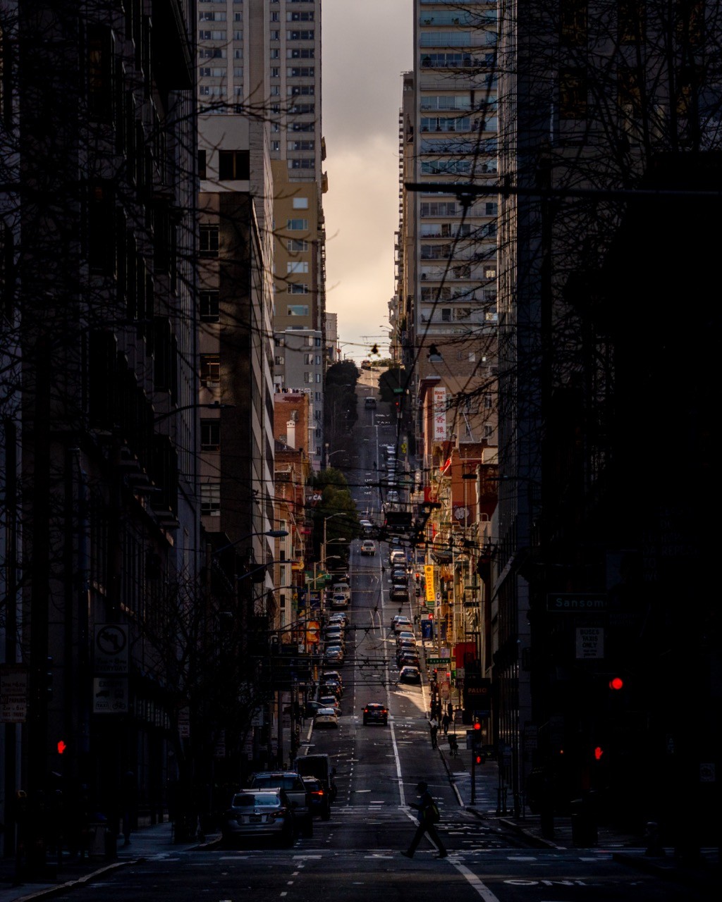 A compressed view up a steep San Francisco street toward Chinatown.